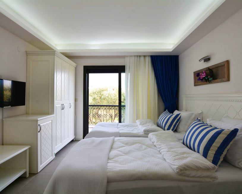 202 – İki Tek Yataklı Çift Kişilik Oda – Bahçe Manzaralı Balkonlu